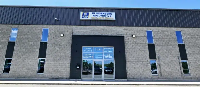 Front door and sign of Klingenberg Automotive in Woodstock, Ontario.